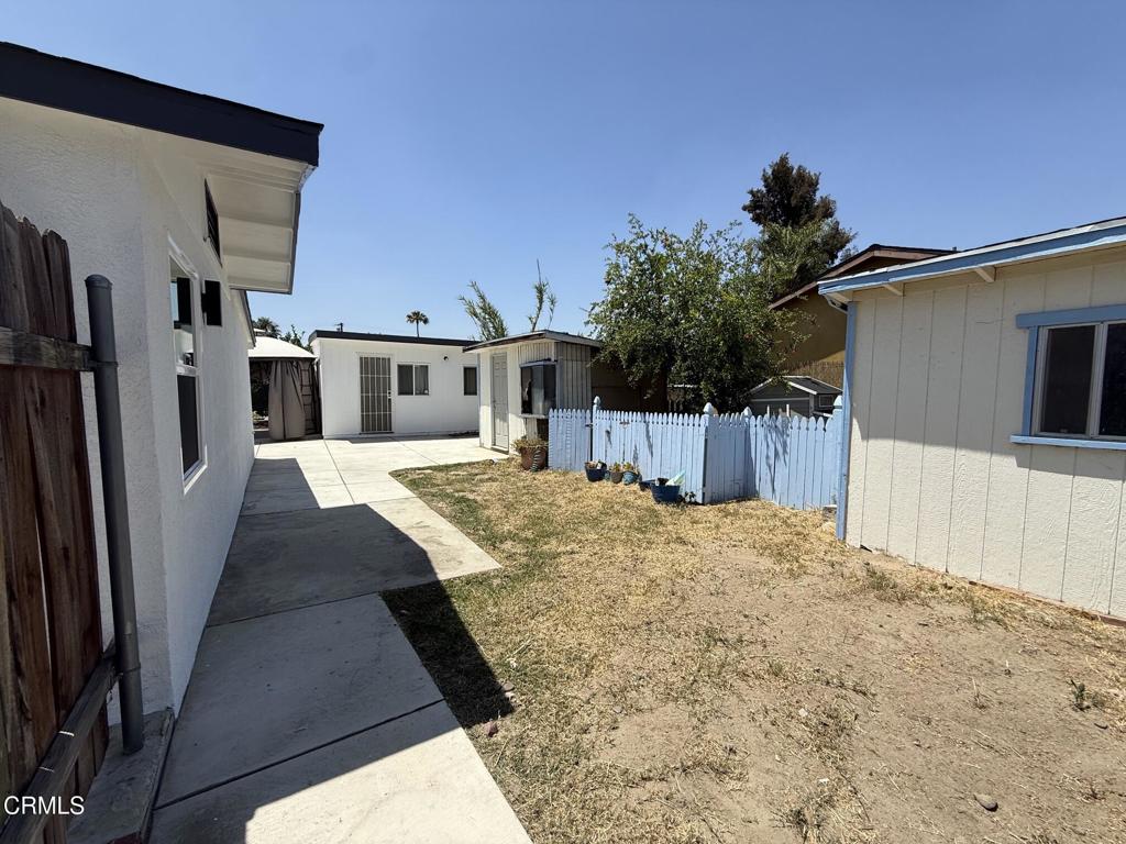 4010 Witt Avenue Riverside, CA 92501 - Photo 18 of 23 a view of a house with a wooden fence