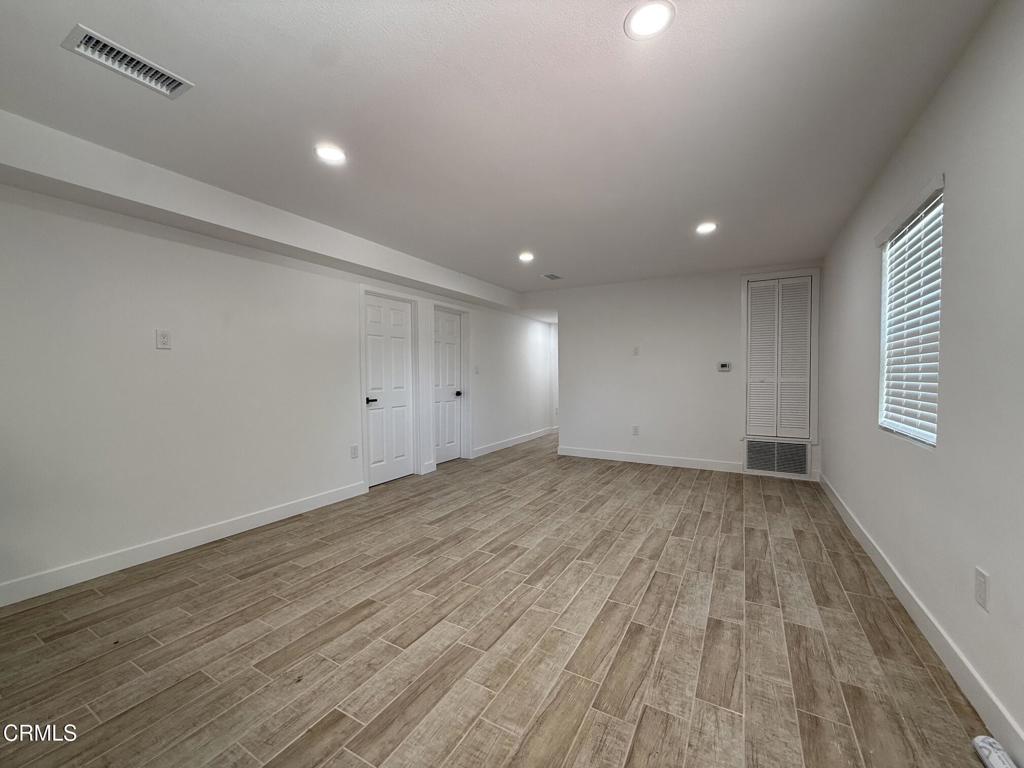 4010 Witt Avenue Riverside, CA 92501 - Photo 5 of 23 wooden floor in an empty room with a window