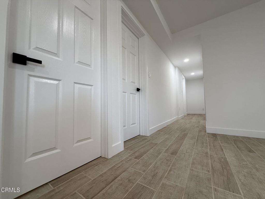 4010 Witt Avenue Riverside, CA 92501 - Photo 6 of 23 a view of a hallway with wooden floor