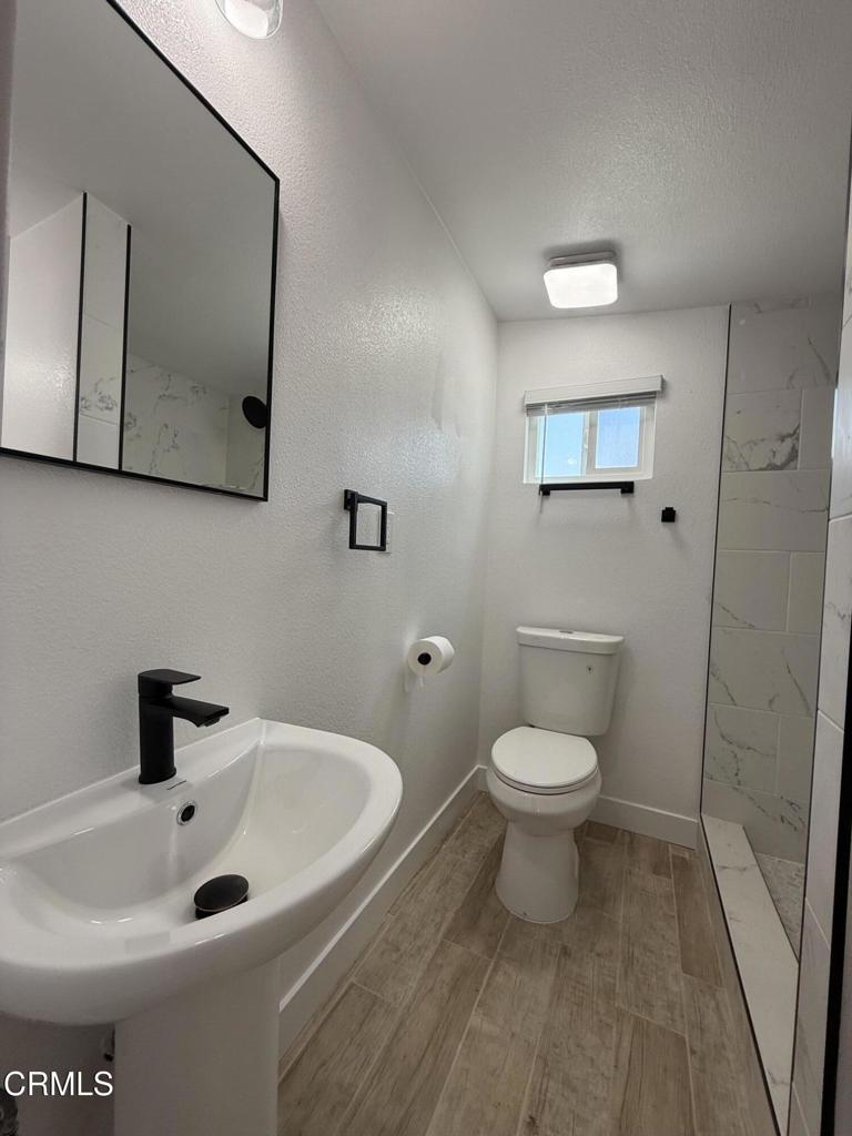 4010 Witt Avenue Riverside, CA 92501 - Photo 8 of 23 a bathroom with a sink and a toilet