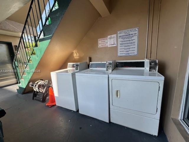 1400 Douglas Road, Unit 14 Coral Gables, FL 33134 - Photo 15 of 19 a utility room with dryer and washer