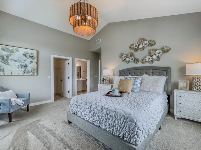 a bedroom with bed and window