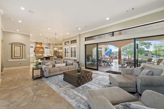 a large kitchen with a table and chairs