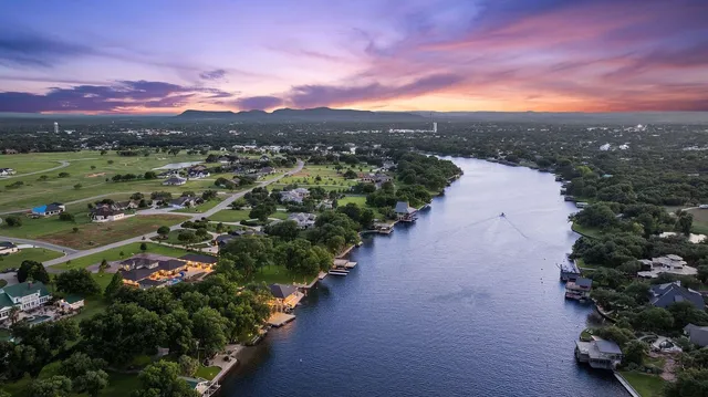 a view of a swimming pool with an outdoor space and seating area