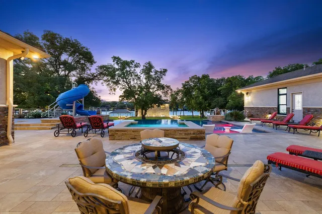 a view of a dinning table and chairs in the patio