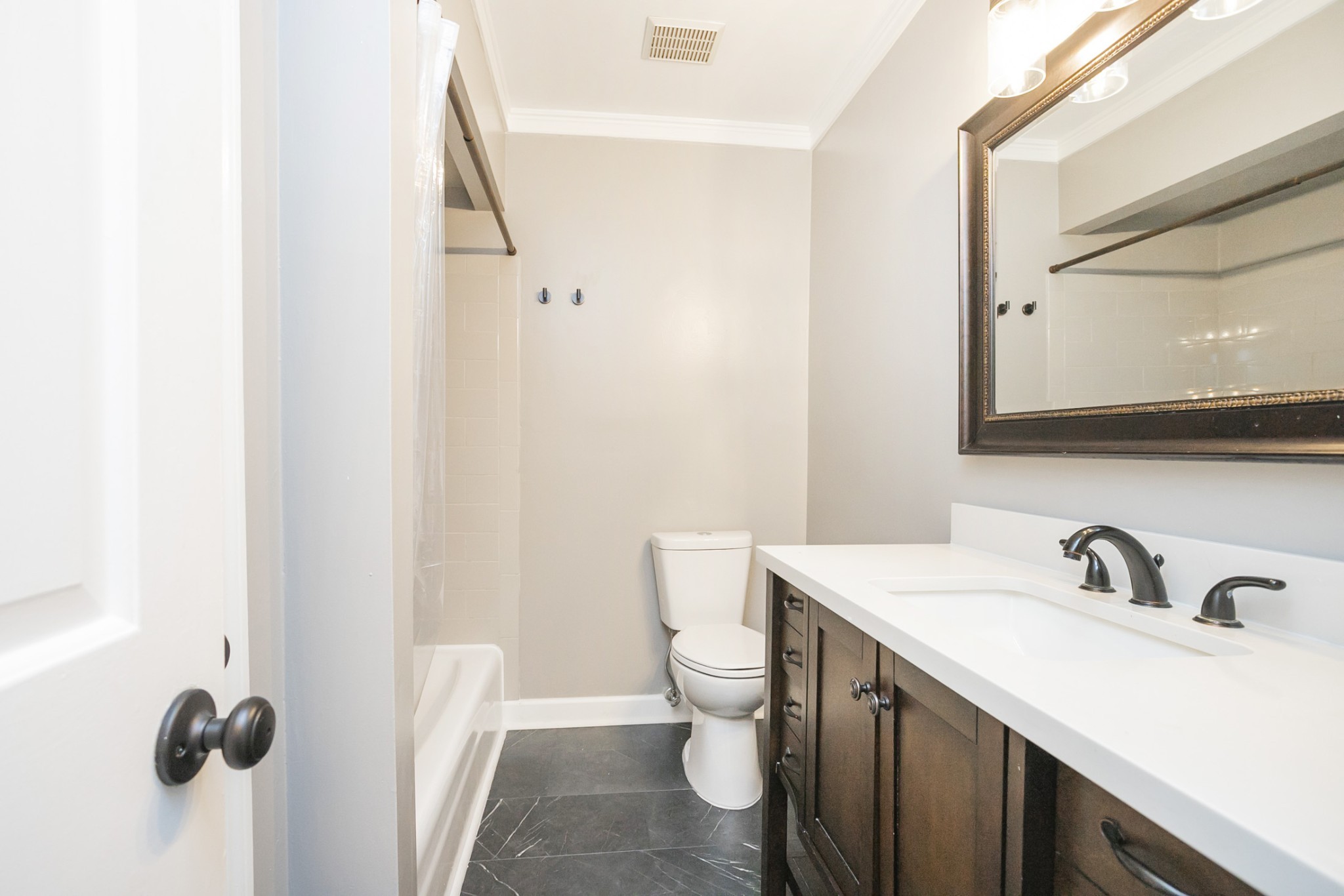 601 Boyd Mill Avenue, Unit C1 Franklin, TN 37064 - Photo 20 of 39 a bathroom with a sink toilet and mirror
