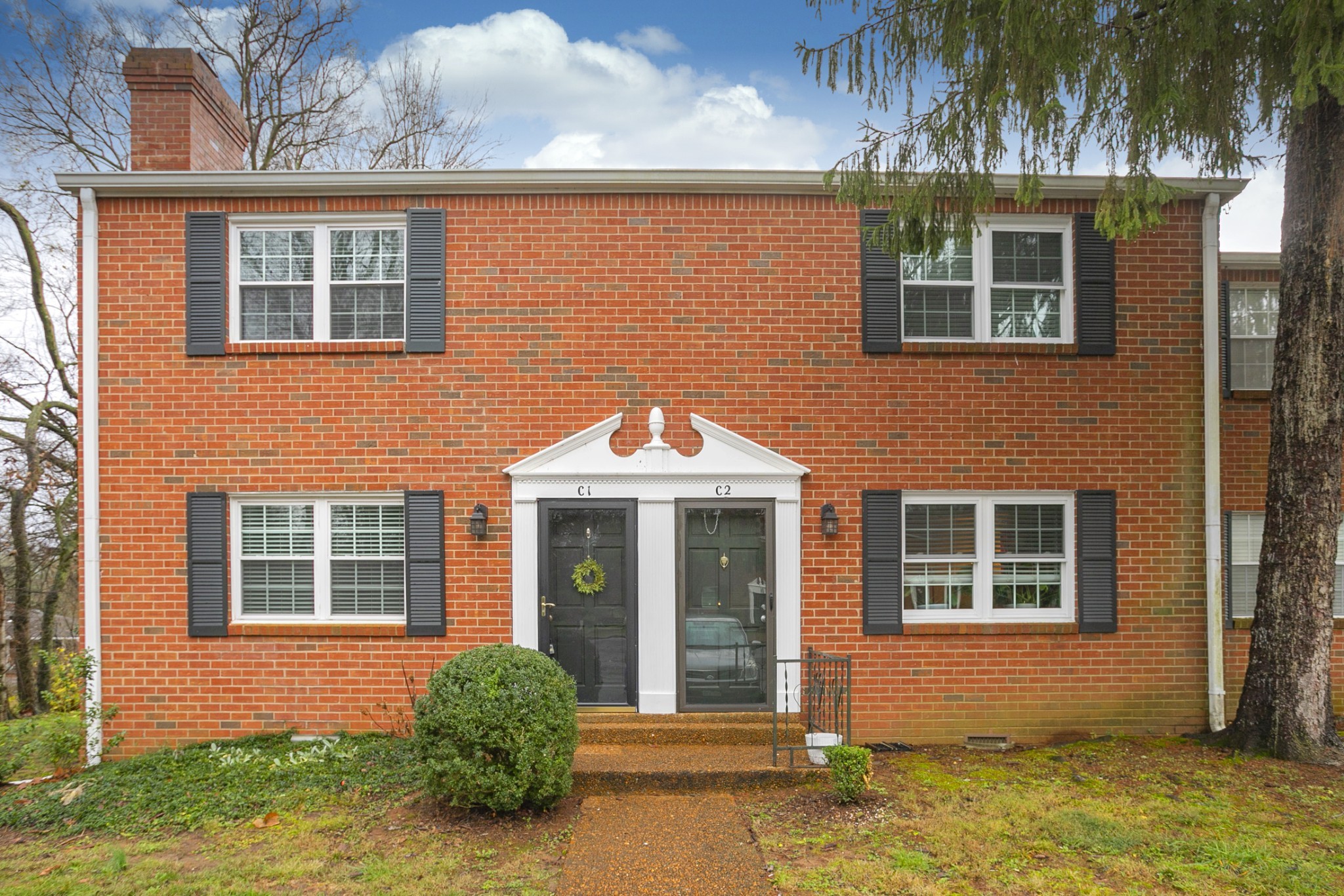 601 Boyd Mill Avenue, Unit C1 Franklin, TN 37064 - Photo 31 of 39 a front view of a house having yard