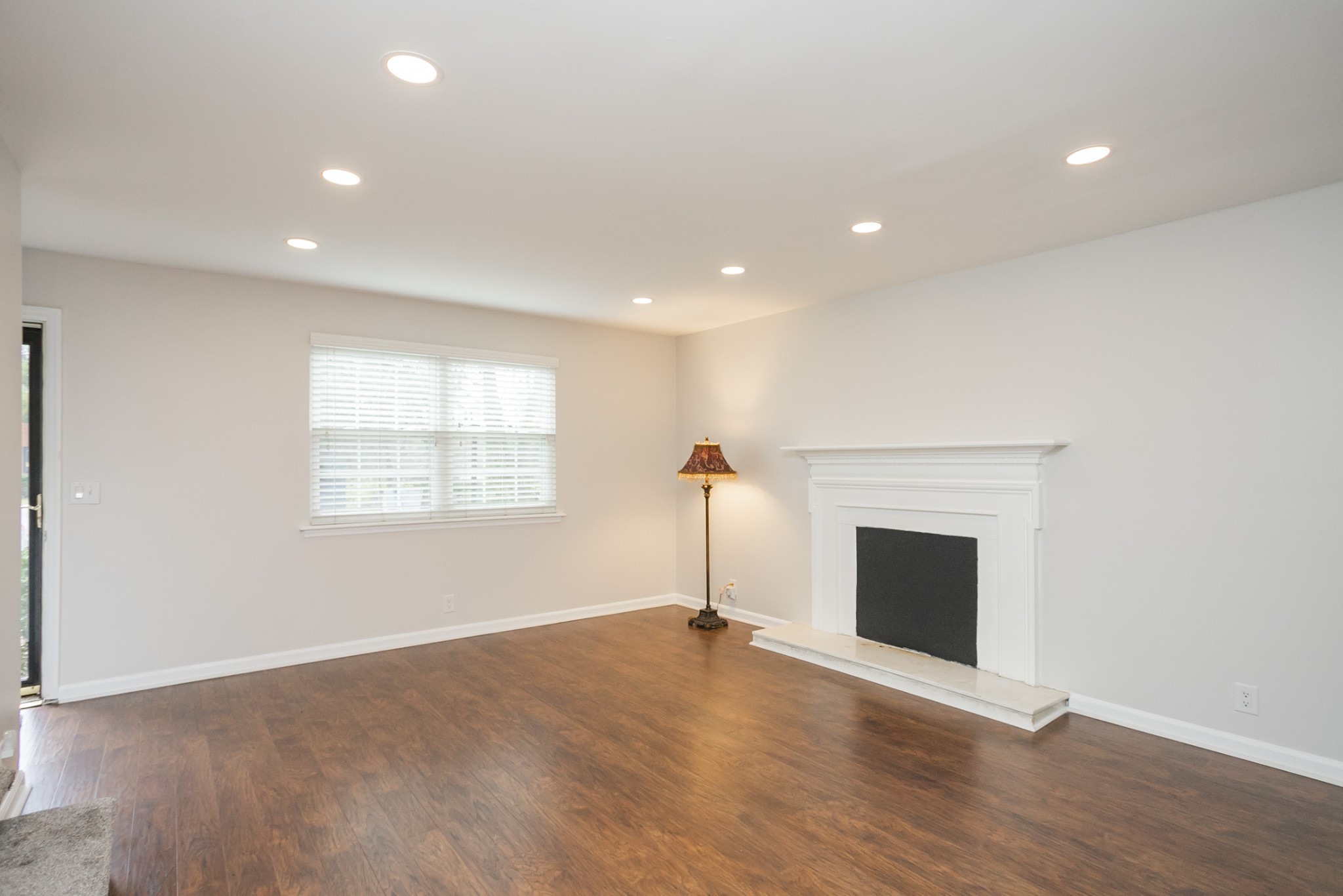 601 Boyd Mill Avenue, Unit C1 Franklin, TN 37064 - Photo 4 of 39 a view of an empty room with a fireplace and a window