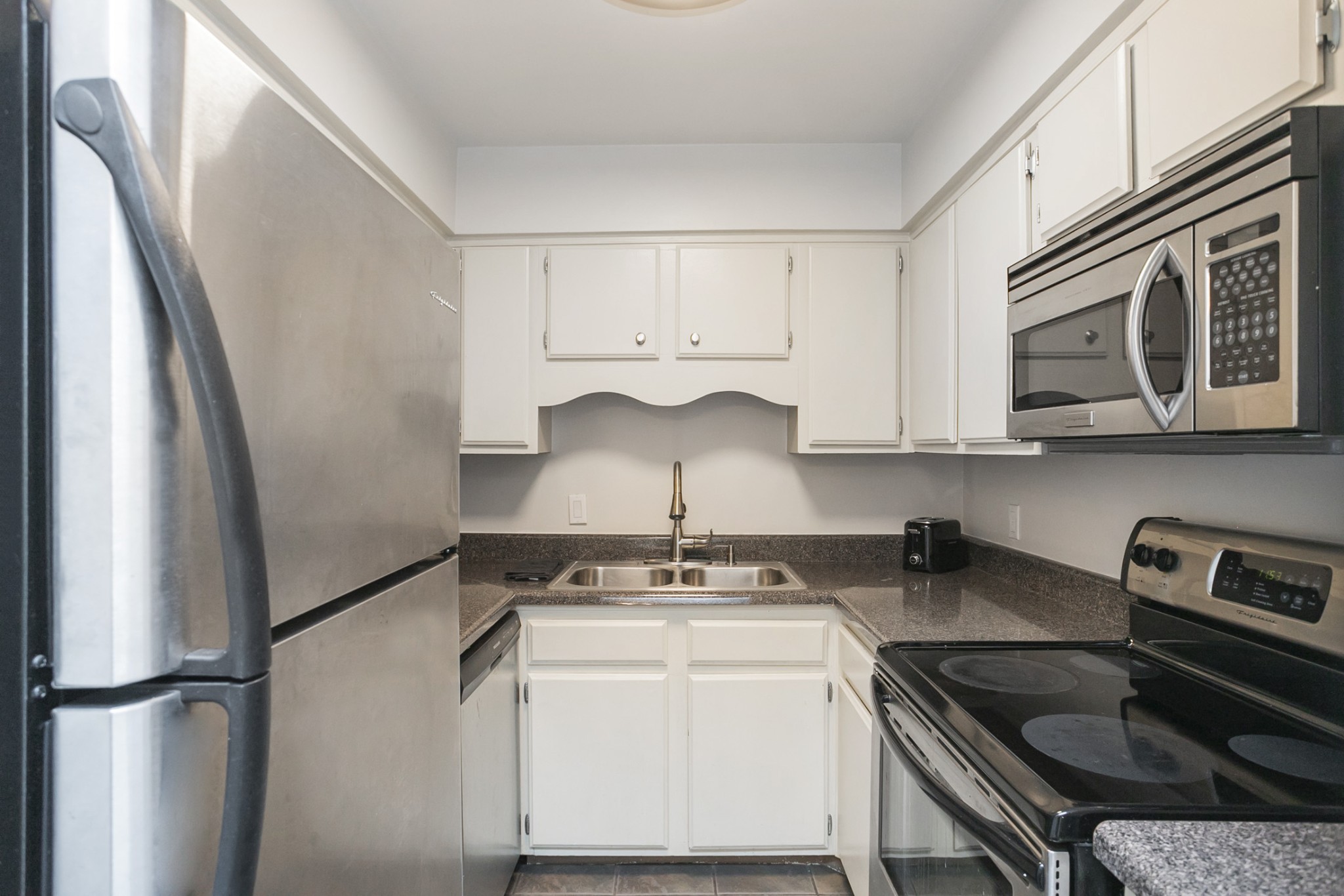 601 Boyd Mill Avenue, Unit C1 Franklin, TN 37064 - Photo 10 of 39 a kitchen with a sink stove and microwave