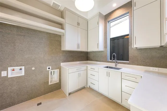 a spacious bathroom with a sink double vanity and mirror