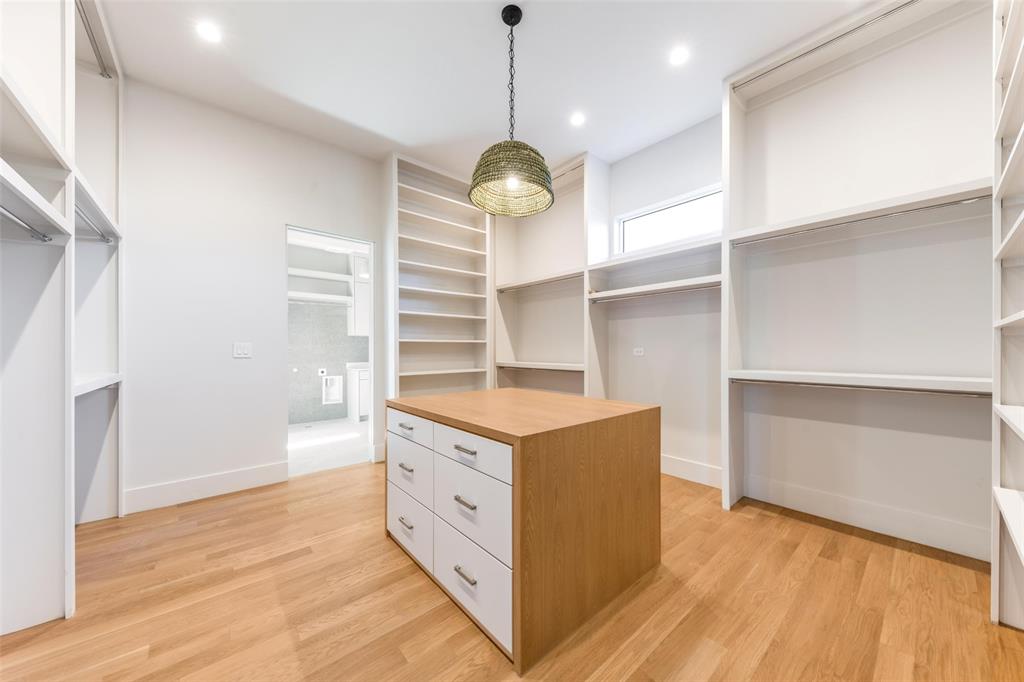 7410 Kenwell Street Dallas, TX 75209 - Photo 27 of 40 a kitchen with stainless steel appliances granite countertop a stove oven and a wooden floor