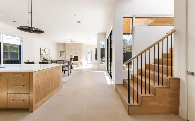 a view of a kitchen with cabinets and a window