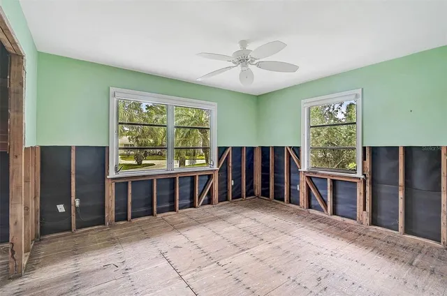a kitchen with stainless steel appliances a refrigerator and a window