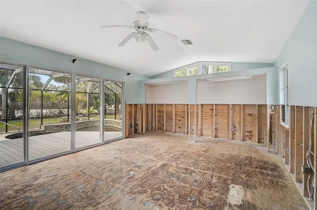 a swimming pool with a table and chairs