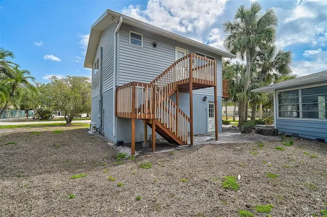 a kitchen with granite countertop cabinets and wooden floor