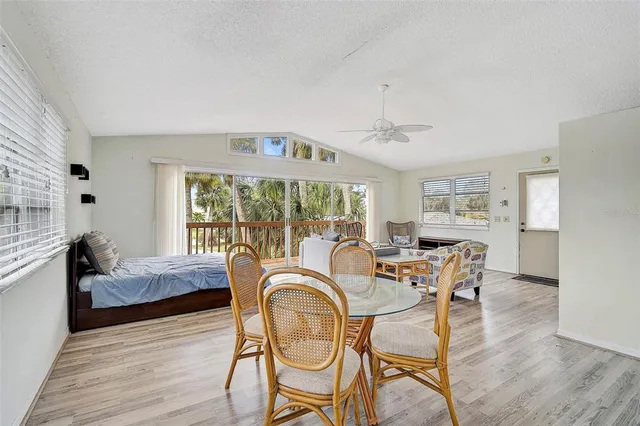 a kitchen with granite countertop white refrigerator sink and cabinets