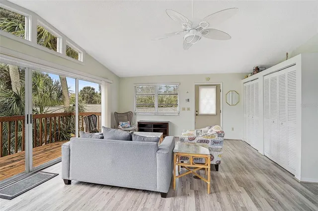 a balcony with wooden floor and fence