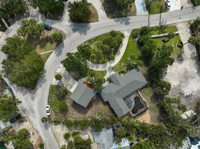 an aerial view of a house with outdoor space