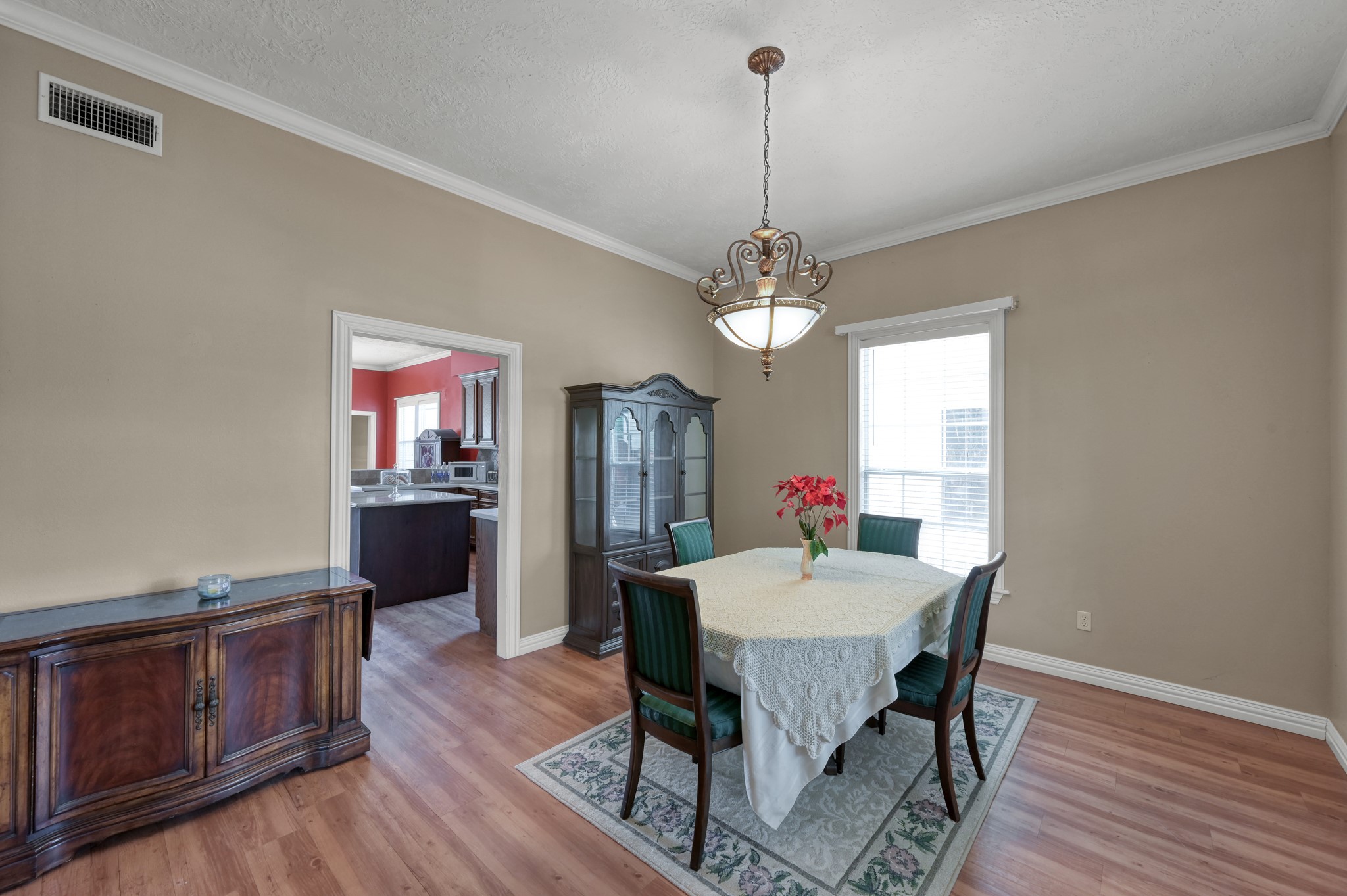 144 Wood Farm Road Huntsville, TX 77320 - Photo 9 of 35 a view of a dining room with furniture window and wooden floor