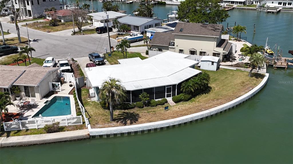 an aerial view of a house with swimming pool and outdoor space