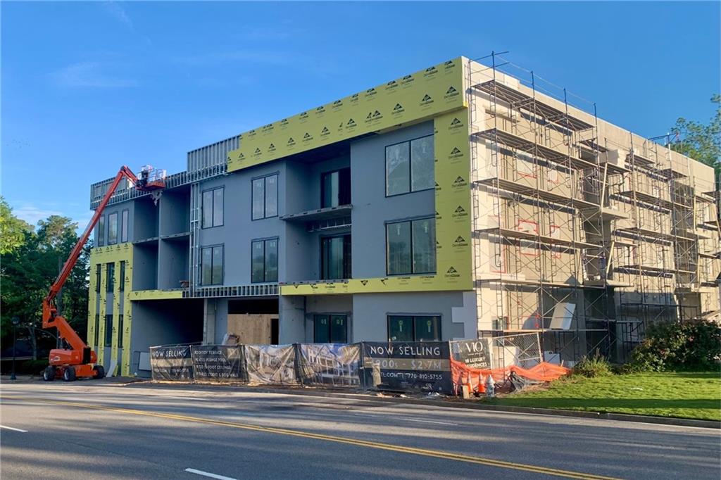 318 Sandy Springs Circle, Unit 110 Atlanta, GA 30328 - Photo 11 of 27 a view of a building with a street