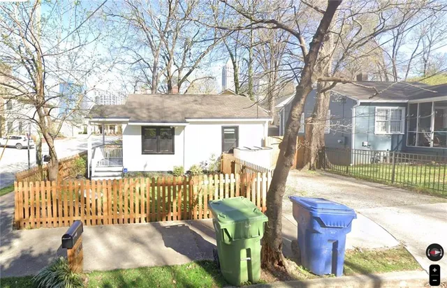 a view of a house with a chairs in a patio