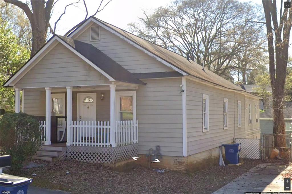 1267 Lyle Place Northwest Atlanta, GA 30318 - Photo 7 of 8 a porch with seating space