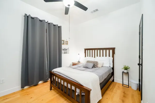 a bedroom with a bed and a table