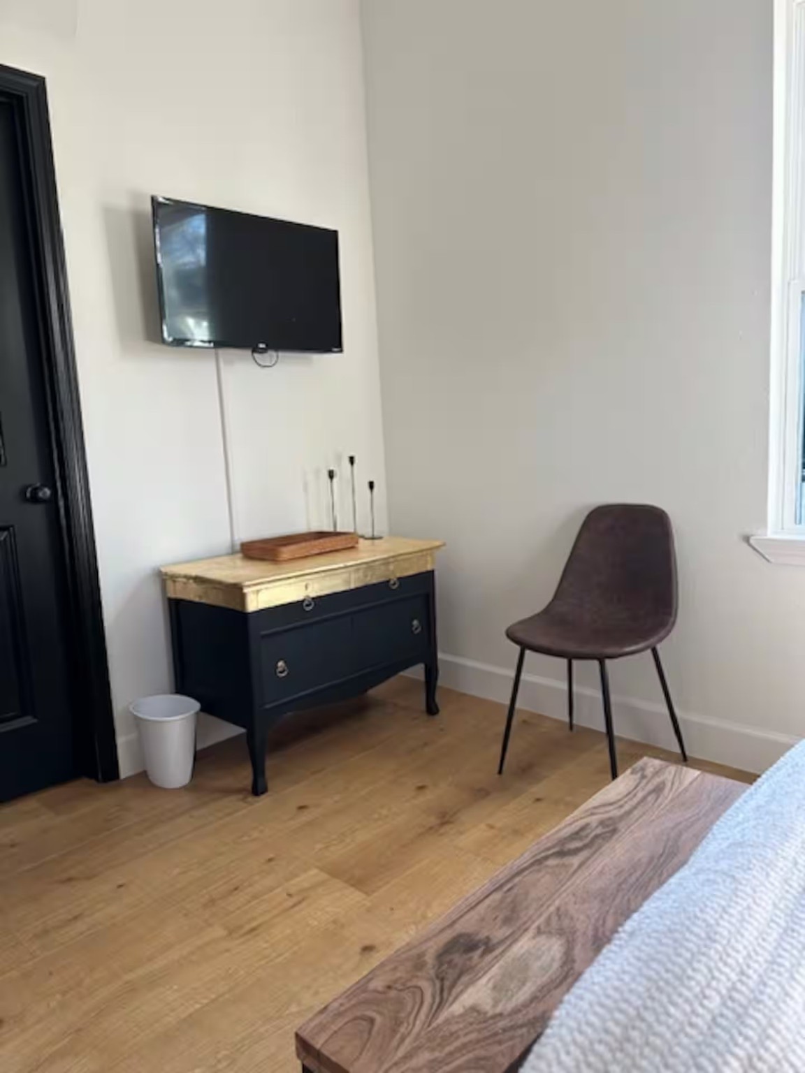 502 Dark Street Brenham, TX 77833 - Photo 12 of 23 a room with a bed and a flat screen tv