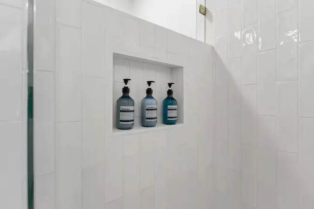 a view of a hallway with paintings on the wall