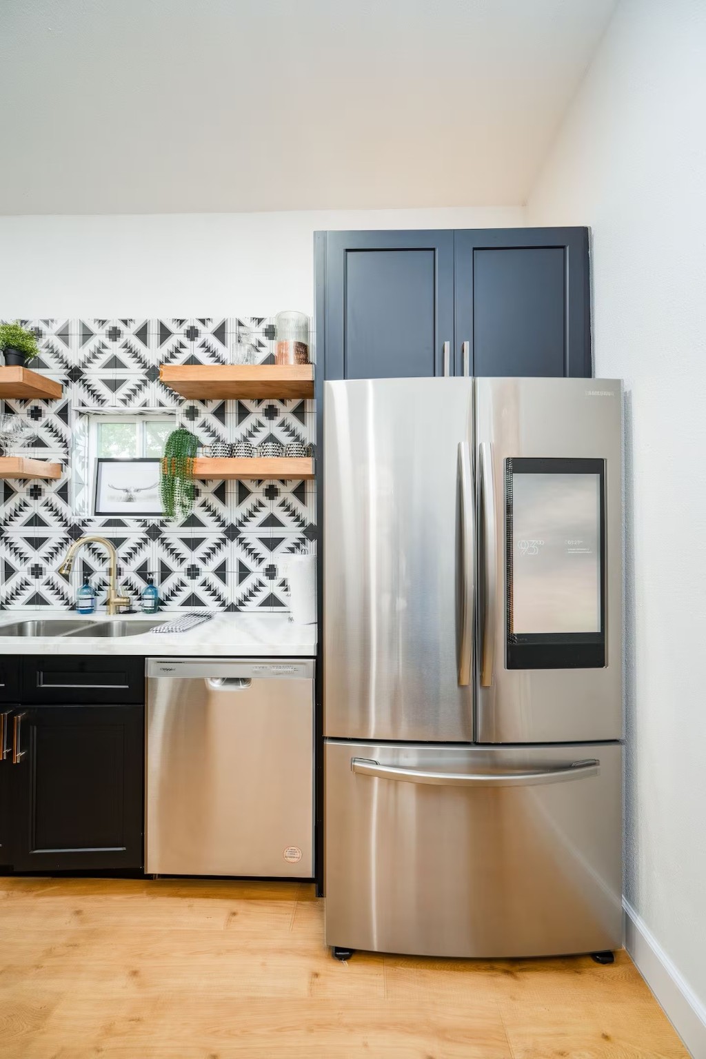 502 Dark Street Brenham, TX 77833 - Photo 6 of 23 a kitchen with stainless steel appliances granite countertop a refrigerator and a stove
