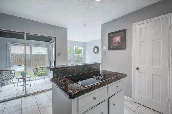 a bathroom with a sink a toilet and a large mirror