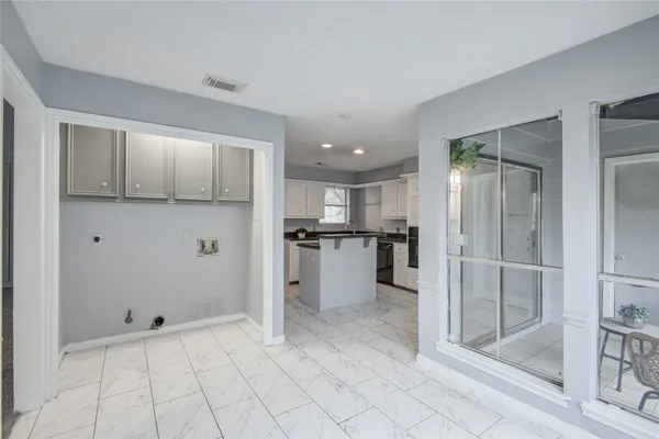 a counter top space with granite countertop a sink and a granite top