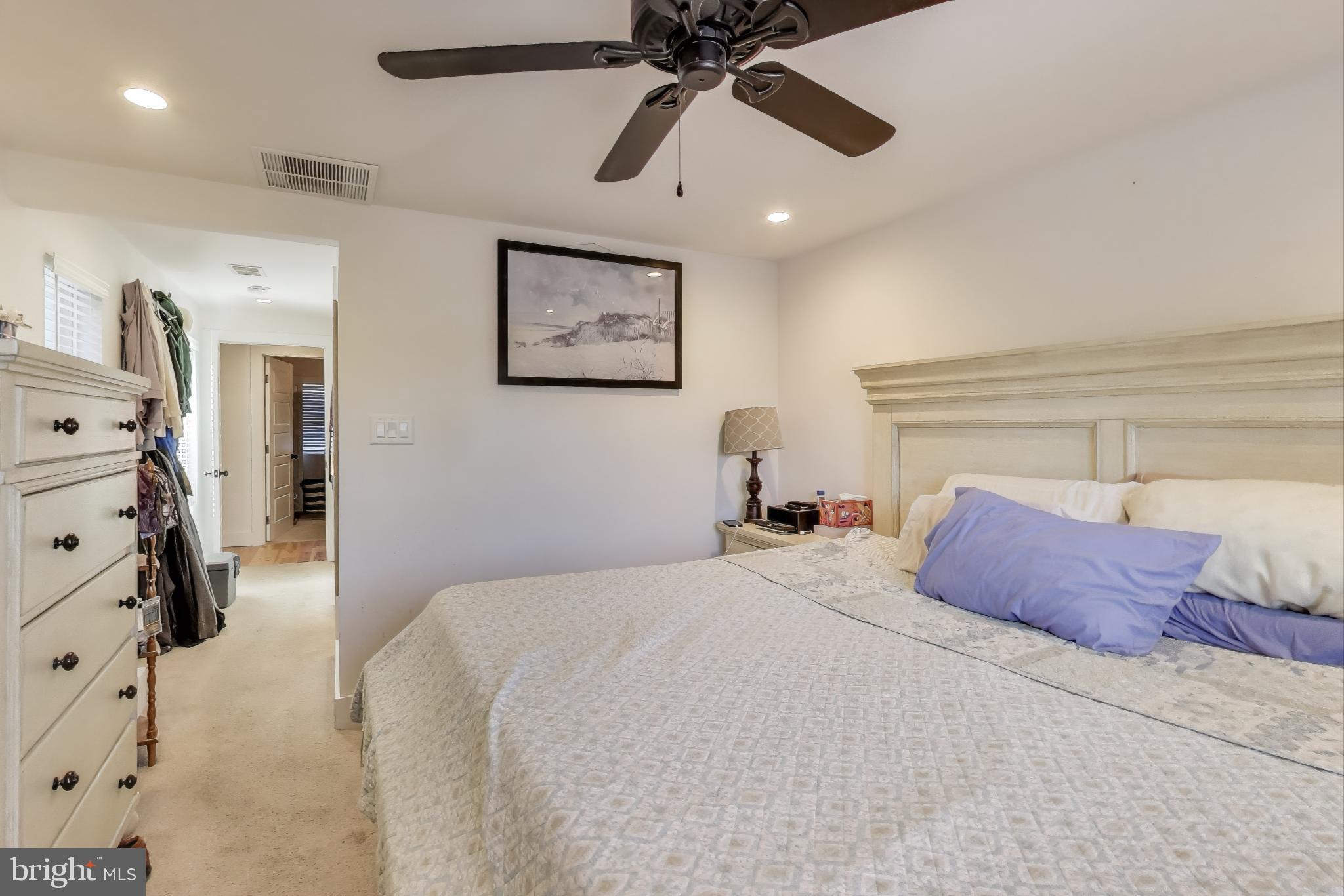 8238 WB&A Road Severn, MD 21144 - Photo 11 of 23 a bedroom with a bed and a chandelier