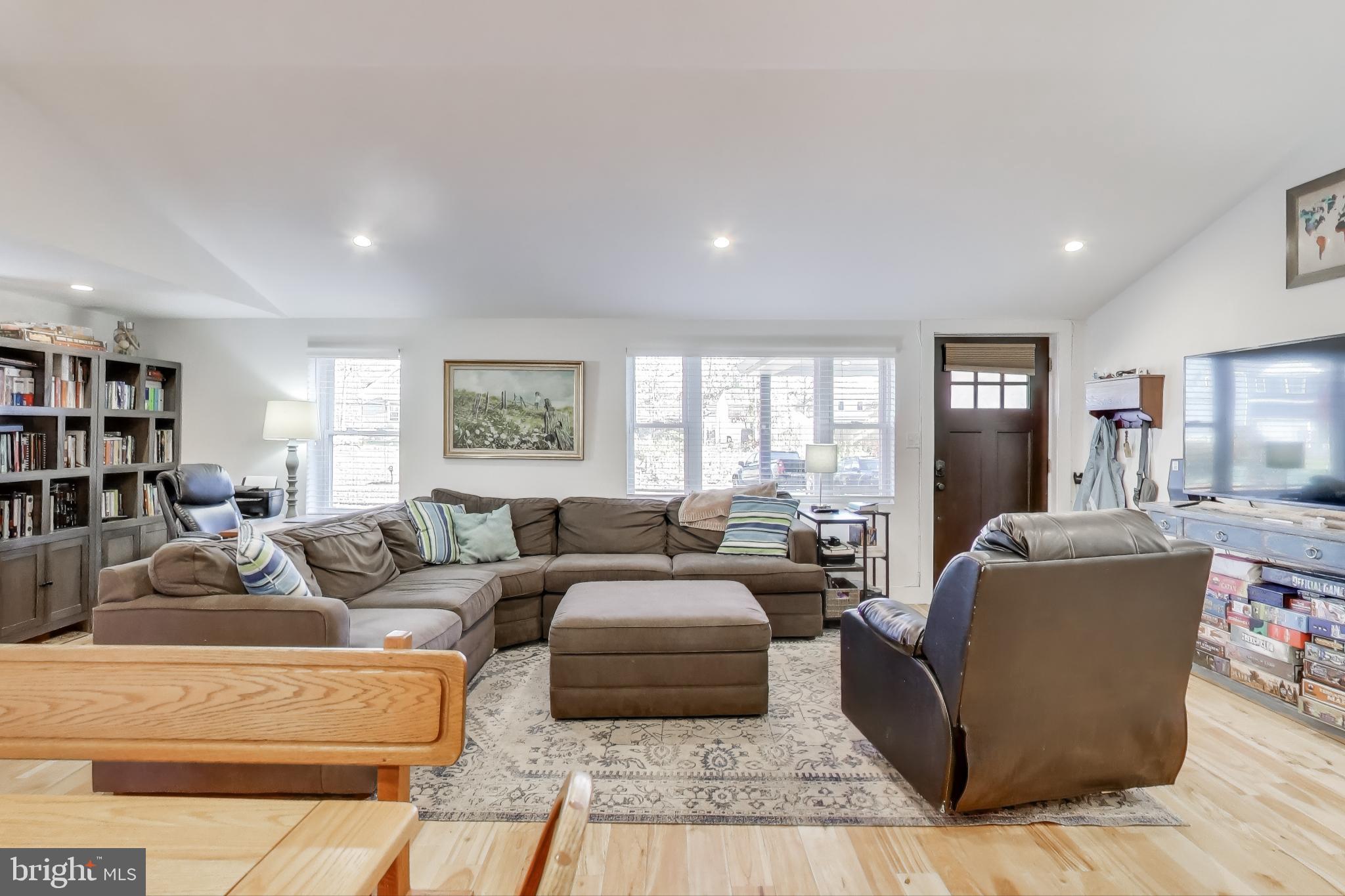 8238 WB&A Road Severn, MD 21144 - Photo 3 of 23 a living room with furniture or couch and a bookshelf