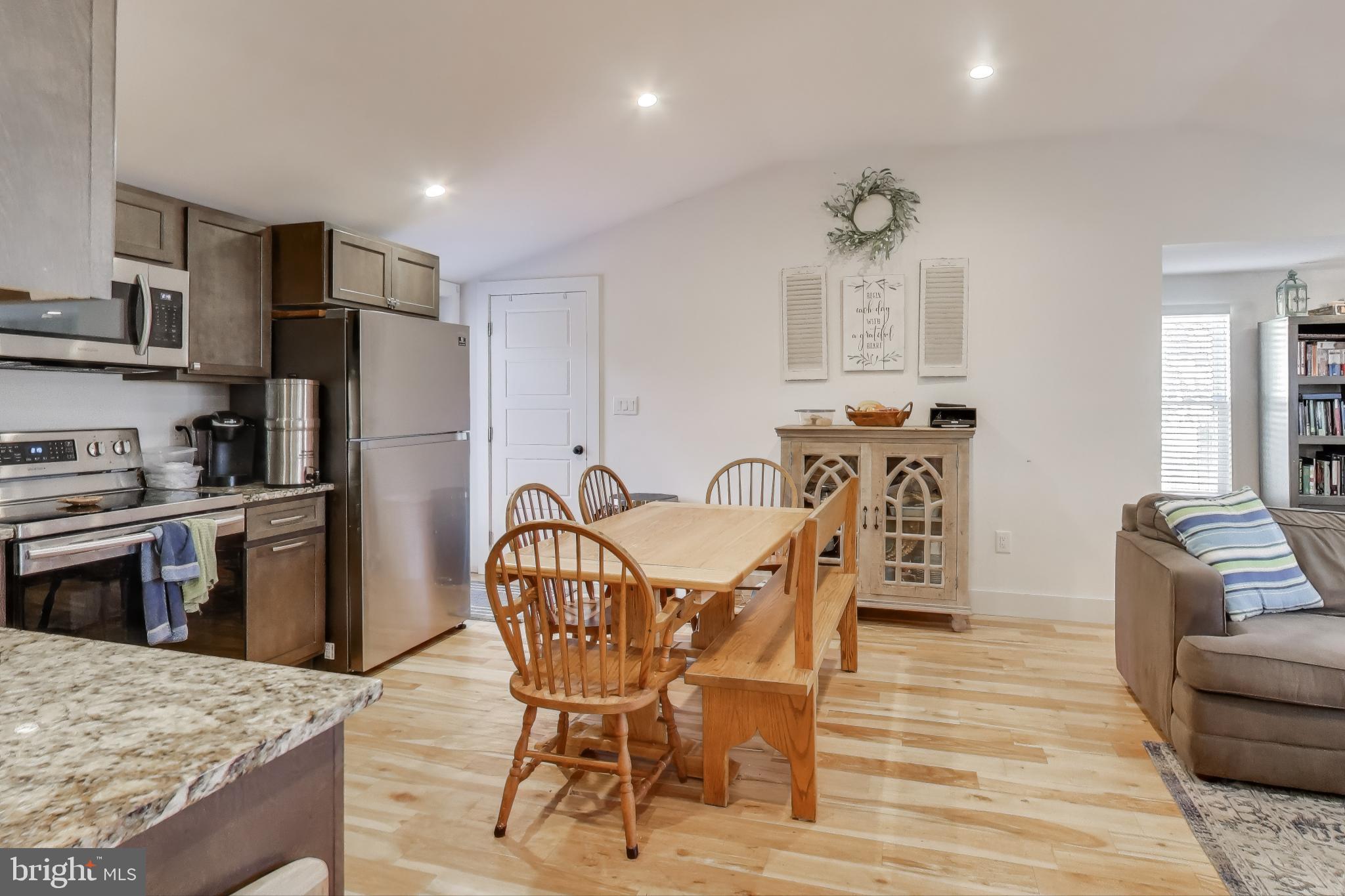 8238 WB&A Road Severn, MD 21144 - Photo 9 of 23 a view of a dining room with furniture