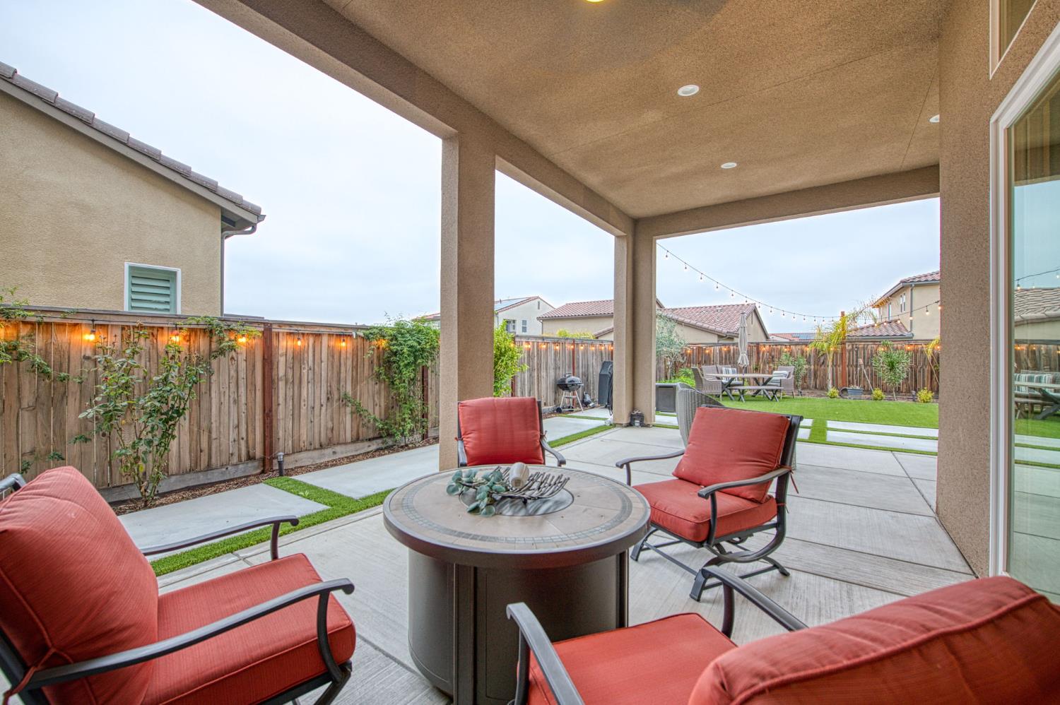 993 Ridgeline Road Madera, CA 93636 - Photo 25 of 84 a living room filled with furniture and a floor to ceiling window