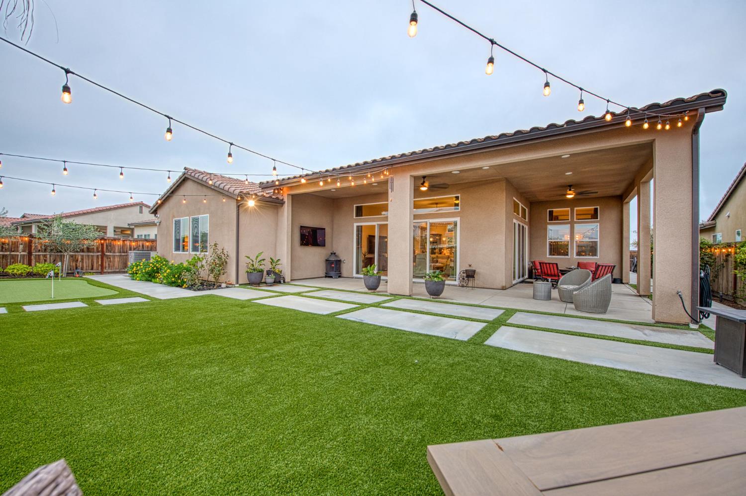 993 Ridgeline Road Madera, CA 93636 - Photo 37 of 84 a view of a house with a patio and a garden