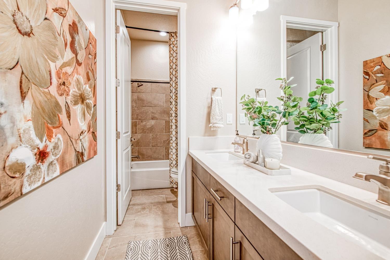 993 Ridgeline Road Madera, CA 93636 - Photo 44 of 84 a bathroom with a granite countertop sink and a mirror