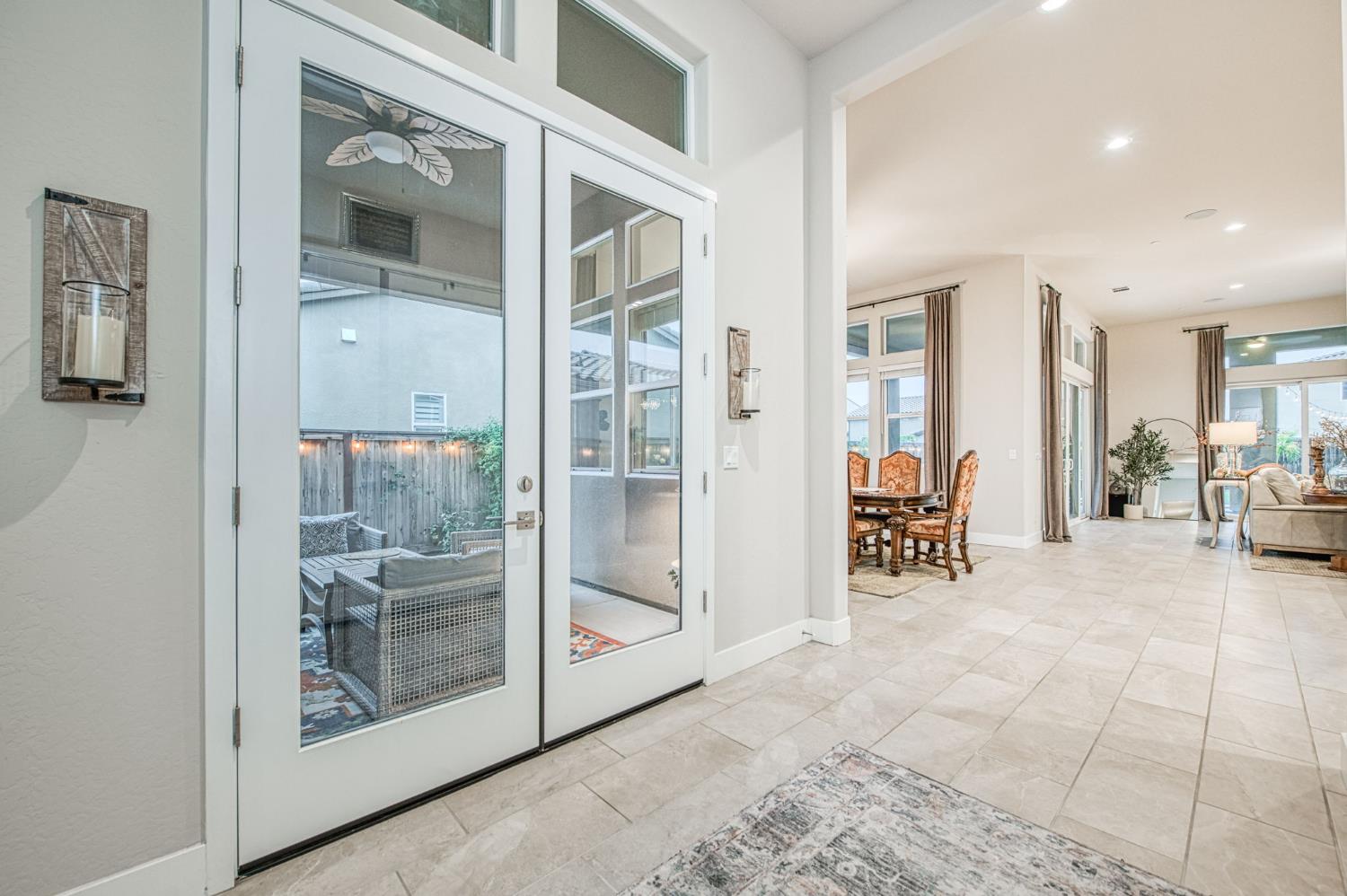 993 Ridgeline Road Madera, CA 93636 - Photo 49 of 84 a view of a hallway with dining area and glass door
