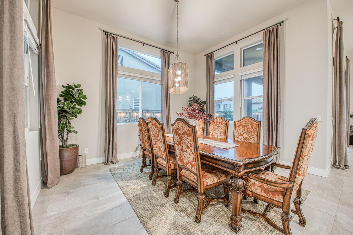 993 Ridgeline Road Madera, CA 93636 - Photo 60 of 84 a view of a dining room with furniture and a potted plant
