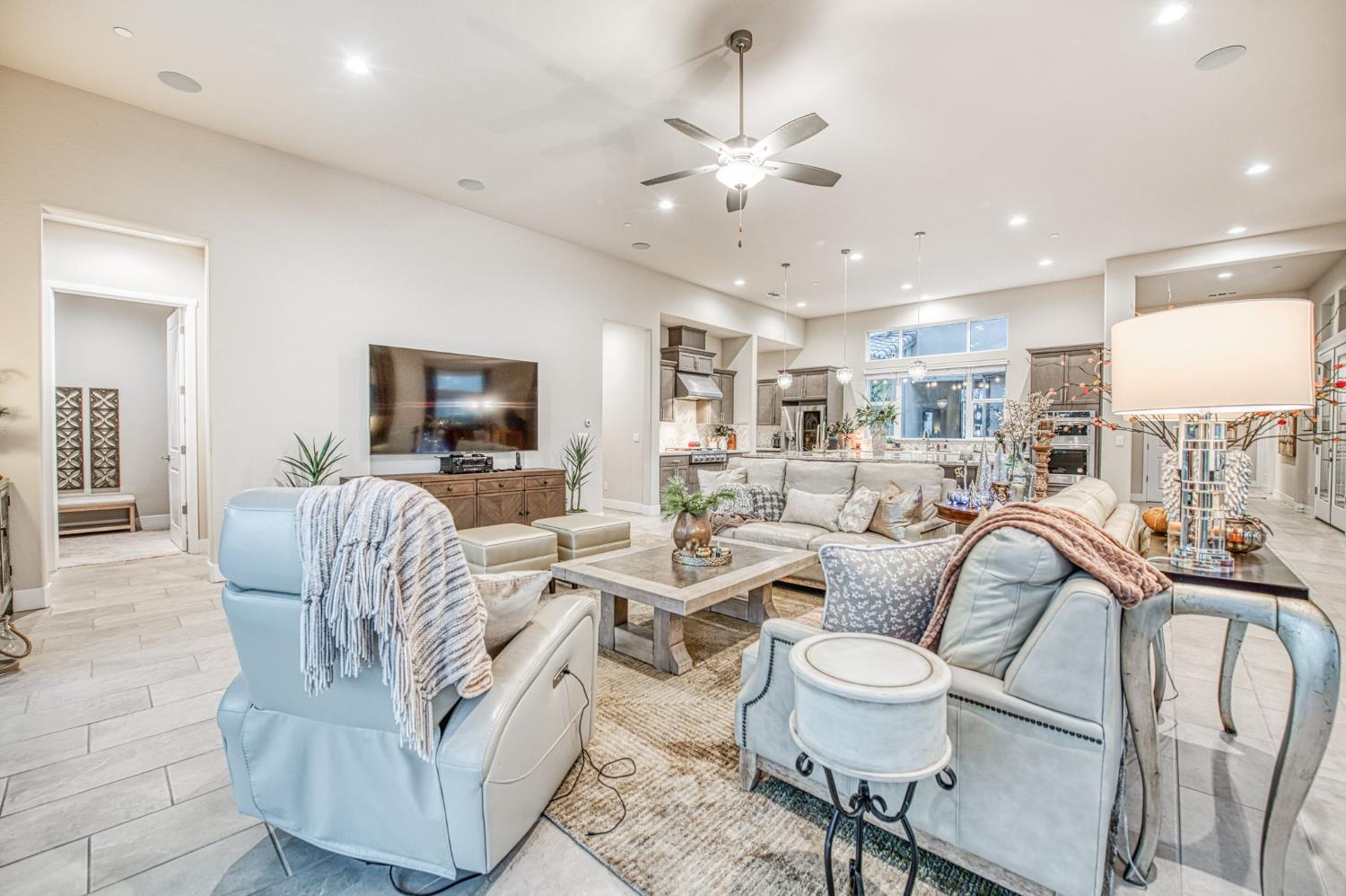 993 Ridgeline Road Madera, CA 93636 - Photo 63 of 84 a living room with furniture kitchen view and a flat screen tv