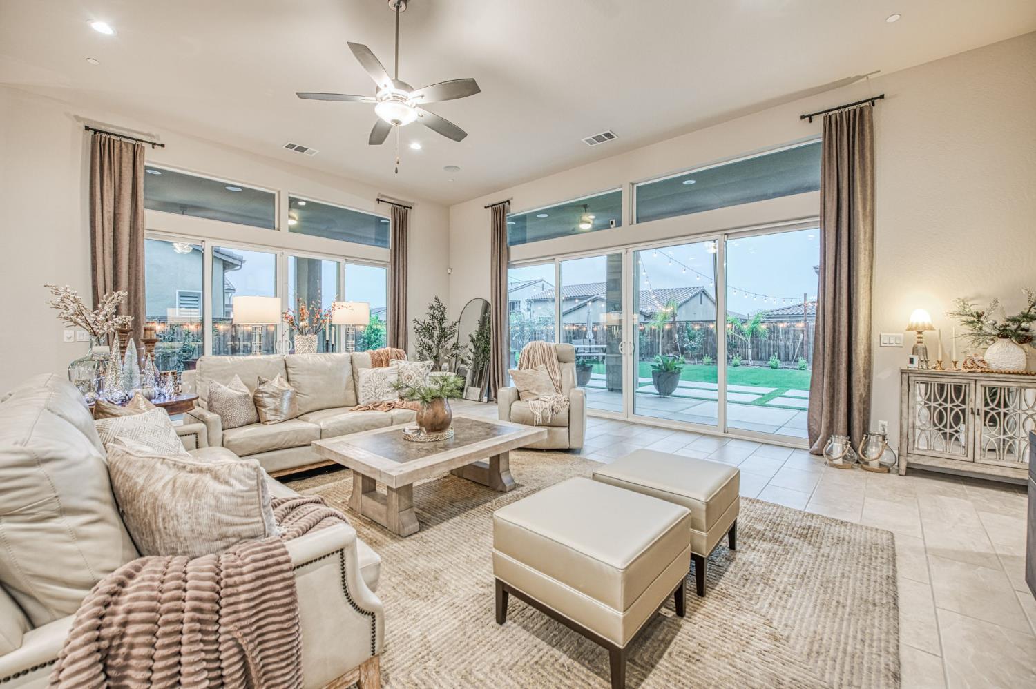 993 Ridgeline Road Madera, CA 93636 - Photo 65 of 84 a living room with furniture and a large window with garden view