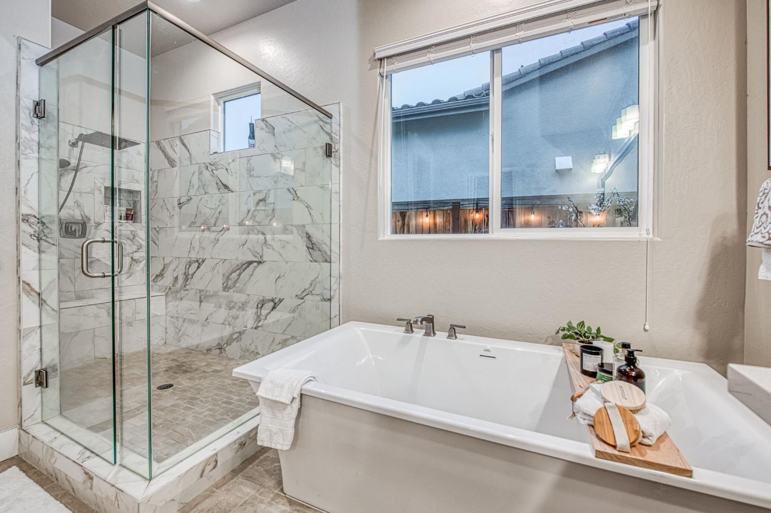 993 Ridgeline Road Madera, CA 93636 - Photo 73 of 84 a bathroom with a tub and a shower