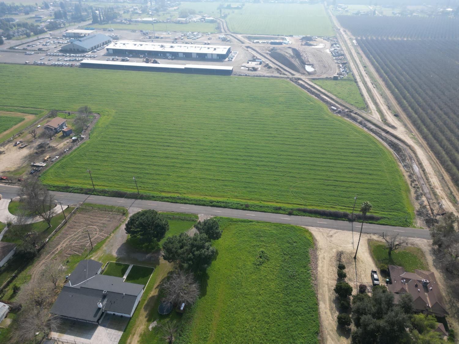 3 West Belcher Avenue Merced, CA 95348 - Photo 4 of 8 a green field with some trees