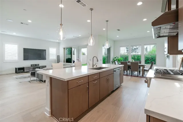 a large kitchen with a large counter top appliances and cabinets