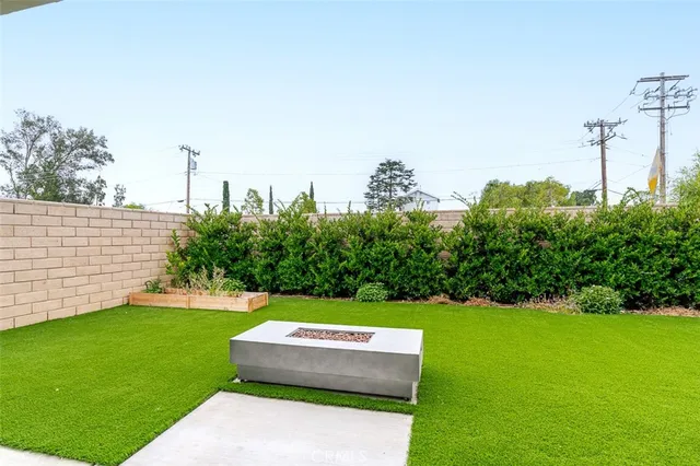 a view of a yard with large trees