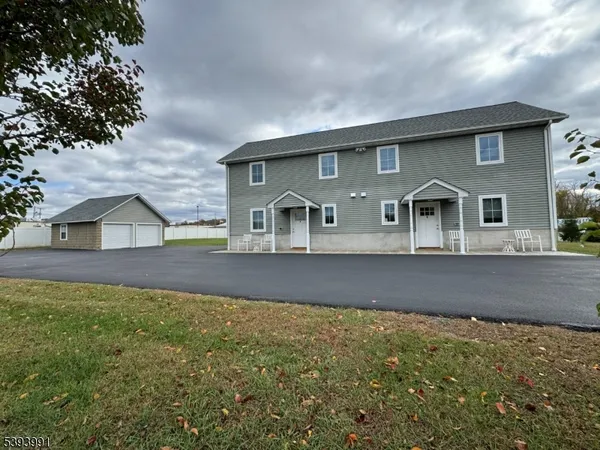 a view of a house with a yard