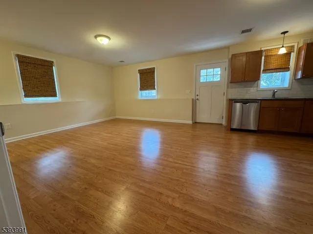 a view of a kitchen with a sink and a microwave