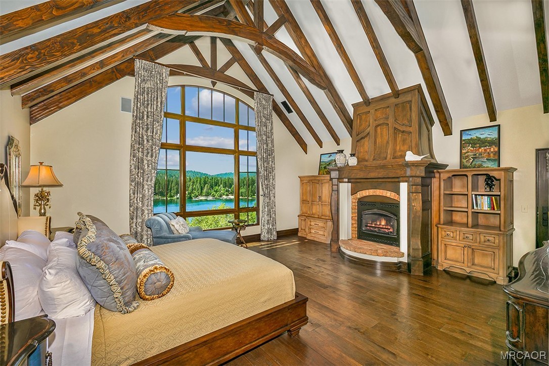 28087 North Shore Road Lake Arrowhead, CA 92352 - Photo 17 of 48 a bedroom with a bed next to a window with outer view